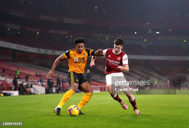 Adama Traore of Wolverhampton Wanderers battles for possession with Kieran Tierney of Arsenal during the Premier League match between Arsenal and...