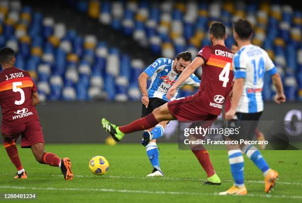 Fabian of SSC Napoli scores their sides second goal whilst under pressure from Juan Jesus and Bryan Cristante of Roma during the Serie A match...