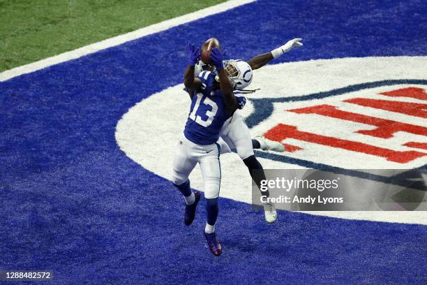 Hilton of the Indianapolis Colts catches a touchdown pass in the fourth quarter against Breon Borders of the Tennessee Titans during their game at...