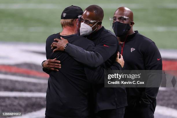 Head coach Jon Gruden of the Las Vegas Raiders greets head coach Raheem Morris of the Atlanta Falcons following their NFL game at Mercedes-Benz...