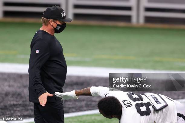 Head coach Jon Gruden of the Las Vegas Raiders greets Arden Key prior to their game against the Atlanta Falcons at Mercedes-Benz Stadium on November...
