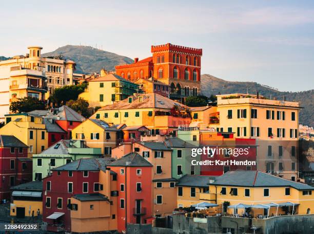 a view of genoa at sunset, beach/village - stock photo - genoa italy stock-fotos und bilder