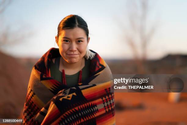 smiling navajo young woman portrait in her home backyard - north american tribal culture stock pictures, royalty-free photos & images