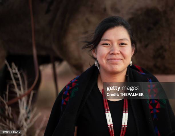 cheerful navajo young woman wearing traditional jewerly - indios imagens e fotografias de stock