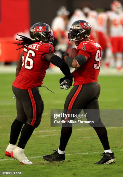 William Gholston of the Tampa Bay Buccaneers celebrates a fumble recovery in the second quarter with teammate Rakeem Nunez-Roches during their game...