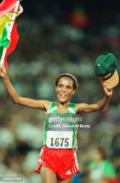 Derartu Tulu of Ethiopia celebrates winning the Women's 10000m at the Olympic Stadium during the Sydney 2000 Olympic Games on September 30th, 2000 in...