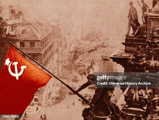 Fascist Germany is defeated. The hoisting of the Soviet flag over the Reichstag, Berlin, 1945.