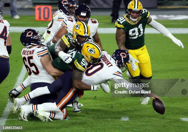 Mitchell Trubisky of the Chicago Bears fumbles the ball during the 1st half of the game against the Green Bay Packers at Lambeau Field on November...