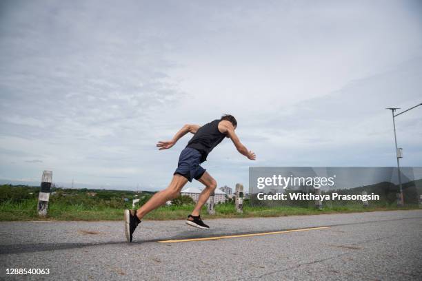 man running and training on running track - sports competition format stock pictures, royalty-free photos & images