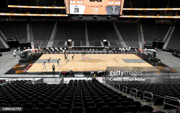 The Washington Huskies and the Baylor Bears play in the first half of their game during the #VegasBubble basketball tournament at T-Mobile Arena on...