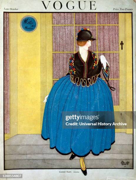 Front cover of Vogue magazine; late October; Published by Cond Nast and Co., London; a lady wears a puffed blue skirt against a yellow door..