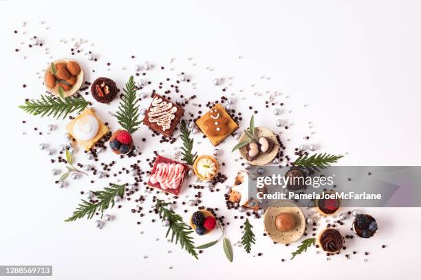 fun, festive assortment of christmas desserts and vegan, gluten-free candy - christmas holiday images stock pictures, royalty-free photos & images