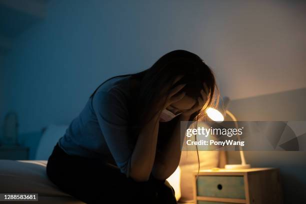 woman feel depress in bedroom - woman suicide stock pictures, royalty-free photos & images