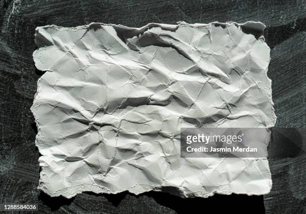crumpled paper on blank chalk blackboard - crumpled paper stock-fotos und bilder