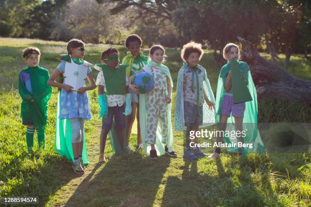 group of eco warrior children together in nature - children of the world imagens e fotografias de stock