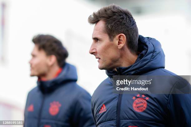 In this handout image provided by FC Bayern Muenchen Miroslav Klose, assistant coach of Bayern Muenchen, arrives for a training session a day before...
