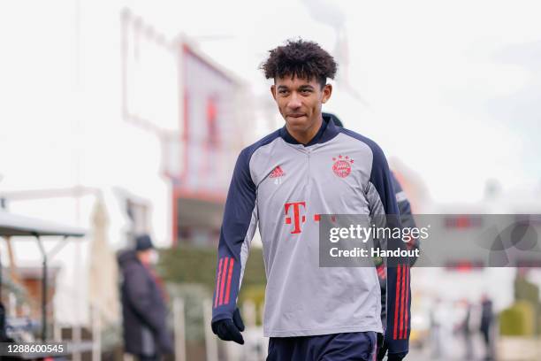 In this handout image provided by FC Bayern Muenchen Chris Richards of FC Bayern Muenchen arrives for a training session a day before the UEFA...