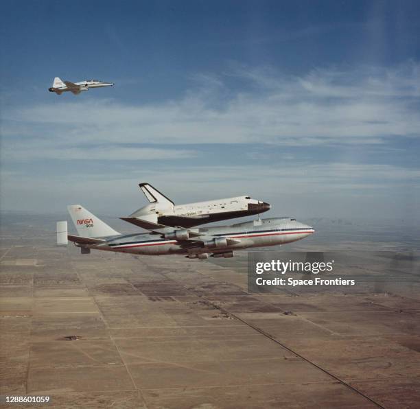 The Space Shuttle Columbia rides 'piggy-back' on NASA 905, a Boeing 747 Shuttle Carrier Aircraft , on its way back to the Kennedy Space Center in...