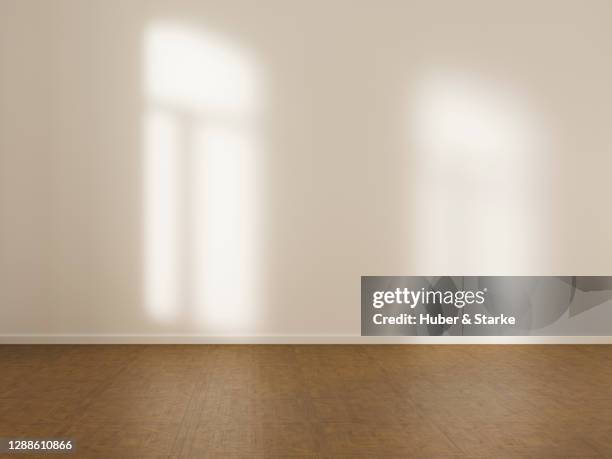 empty room with white wall and hardwood floor - apartment no furniture stockfoto's en -beelden