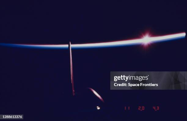 The vertical stabiliser of the Space Shuttle Columbia during NASA's STS-5 mission, with the Earth's horizon in the background, November 1982.