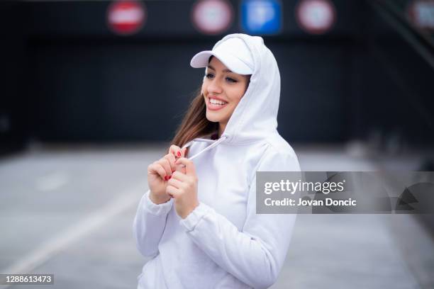 beautiful smiling girl - hoodie stock pictures, royalty-free photos & images
