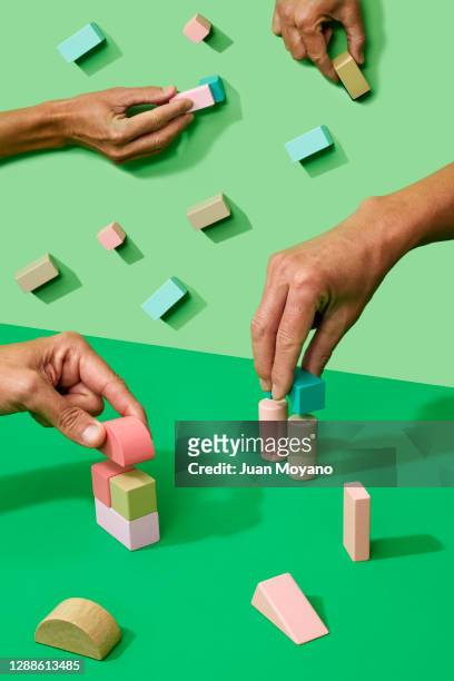 men playing with toy blocks - toy block stock pictures, royalty-free photos & images