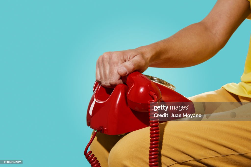 Man Using Red Telephone Man With An Old Red Telephone In His Hand High-Res Stock Photo - Getty ...