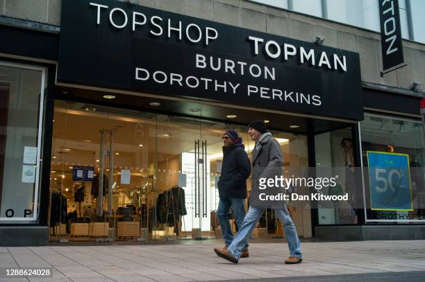 Members of the public walk past a store encompassing Topshop, Topman, Burton and Dorothy Perkins on November 30, 2020 in London, England. Sir Philip...