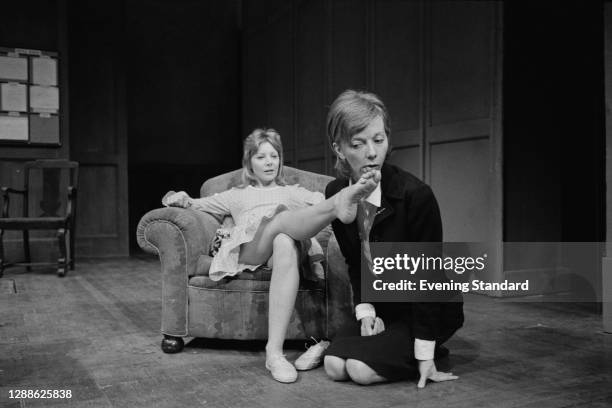 English actress Anna Massey licks the foot of co-star Barbara Ferris in a scene from the David Hare play 'Slag' at the Royal Court Theatre in London,...