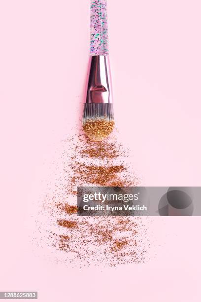 golden strokes or smears of holographic glitter. - glitter make up stock pictures, royalty-free photos & images