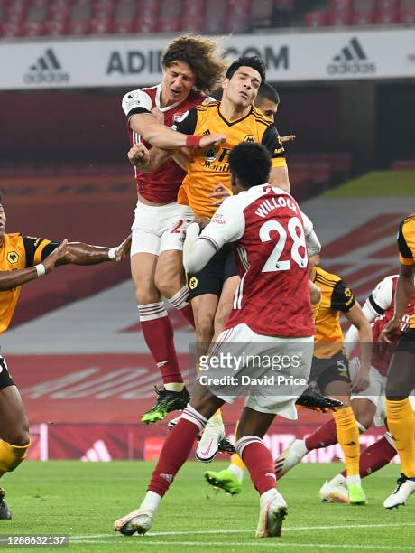 David Luiz of Arsenal clashes heads with Raul Jimenez of Wolves during the Premier League match between Arsenal and Wolverhampton Wanderers at...