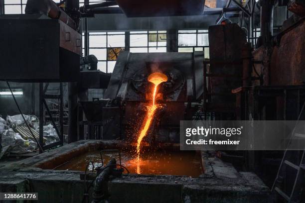 industrial copper casting in factory - pesca de lançamento imagens e fotografias de stock