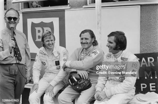 From second left to right, racing drivers Ronnie Peterson, Graham Hill and Emerson Fittipaldi at Brands Hatch, UK, during the Rothmans International...