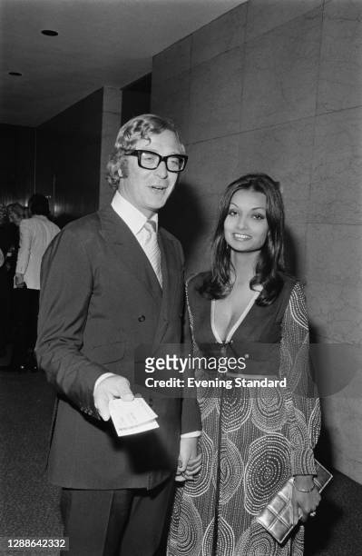 English actor Michael Caine with his partner, later his wife, Guyanese actress Shakira Baksh at the London Hilton, UK, September 1971.