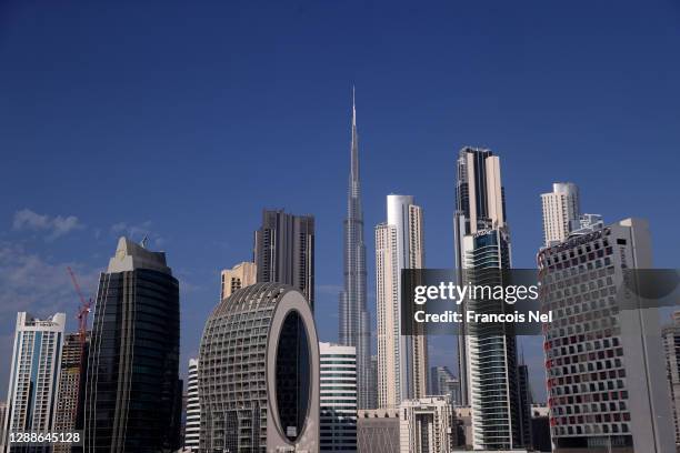 The Burj Khalifa, stands surrounded by other skyscrapers on November 29, 2020 in Dubai, United Arab Emirates. The country's government recently...