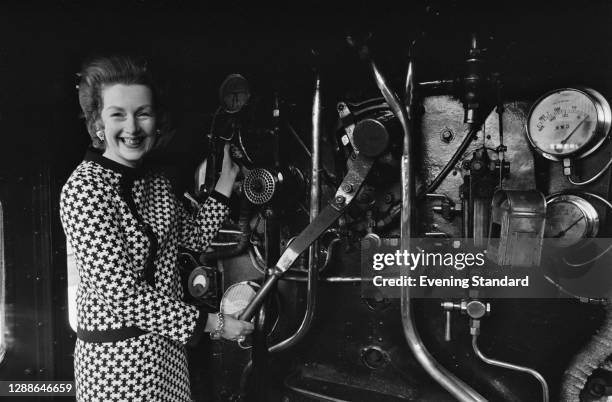 Raine Spencer, Countess Spencer of Dartmouth , on the footplate of the GWR 6000 Class 6000 King George V steam locomotive, UK, 1971. The train is the...