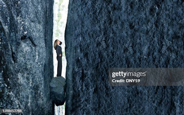 stuck between a rock and a hard place - trapped business stock pictures, royalty-free photos & images