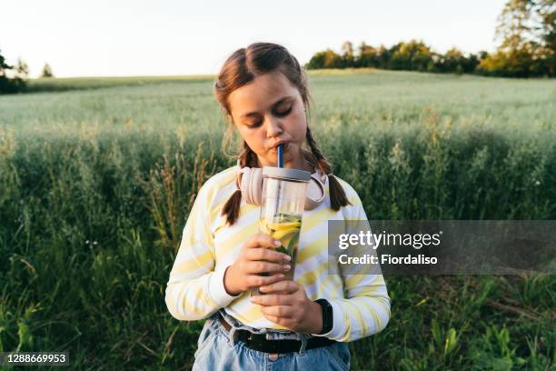 portrait of a beautiful girl dancing - limonade stockfoto's en -beelden