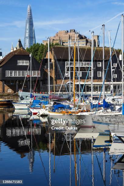 England, London, Wapping, Yachts Moored in St. Katharine Docks Marina with The Shard in the Background.