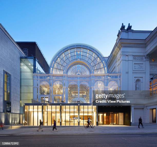 Glass pavilion below Floral Hall viewed at dusk from Bow Street. Royal Opera House, London, United Kingdom. Architect: Stanton Williams, 2018.