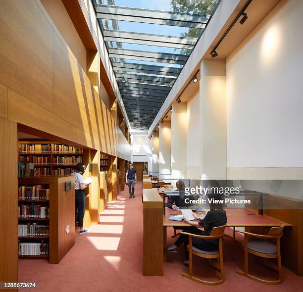 Interior view of library with students studying. Study Centre at St Johns College Library, Oxford, United Kingdom. Architect: Wright & Wright...