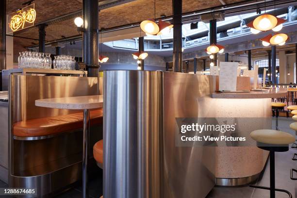 Booth and counter seating. Seven Dials Market, London, United Kingdom. Architect: Stiff + Trevillion Architects, 2019.