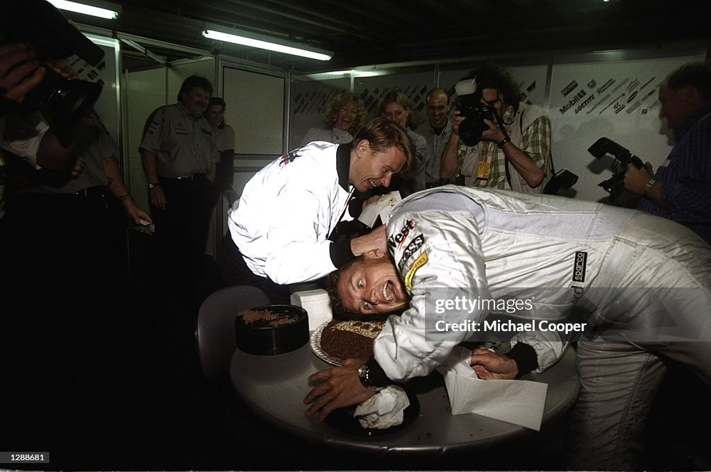 27 Mar 1998:  McLaren Mercedes driver David Coulthard of Scotland is pushed head first into his 27th