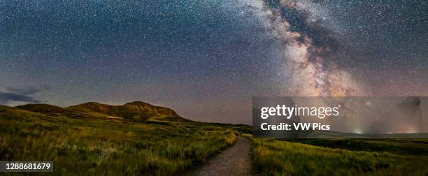 The summer Milky Way behind the hills of 70 Mile and Eagle Buttes at Grasslands National Park, Saskatchewan. This was a very clear, dark night on...