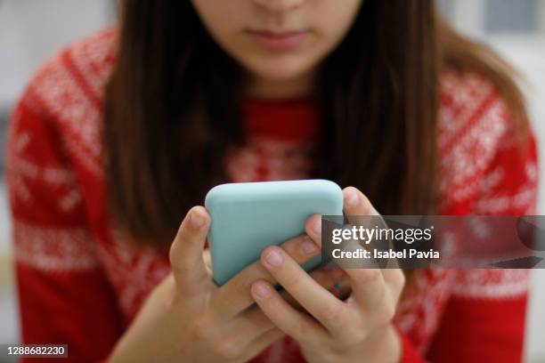 young woman using smart phone - very young webcam girls stock pictures, royalty-free photos & images