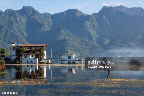Flooded buildings in San Pedro la Laguna on Lake Atitlan in Guatemala. SInce 2009, the lake has risen more than 30 feet, flooding many properties...