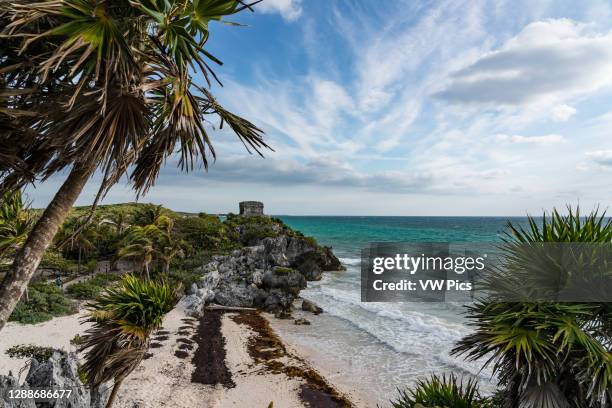 The Temple of the Wind God in the ruins of the Mayan city of Tulum on the coast of the Caribbean Sea. Tulum National Park, Quintana Roo, Mexico.