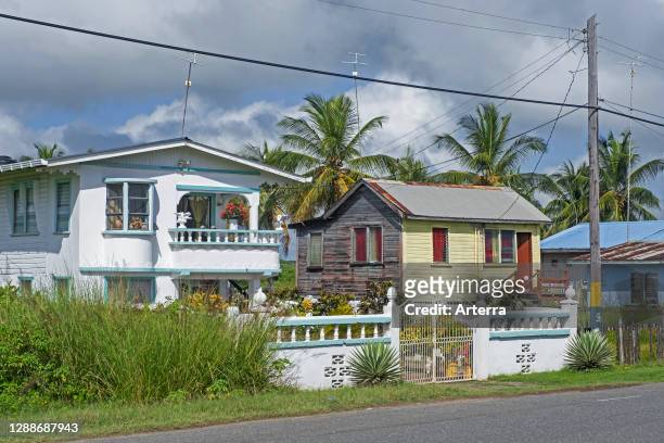 Rural village with traditional wooden houses in the countryside of Guyana, South America.