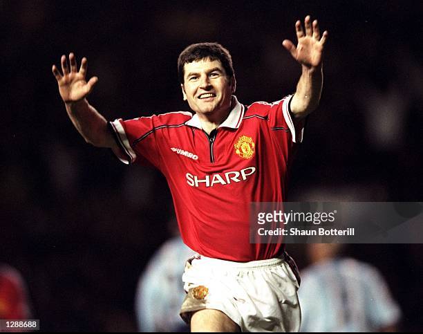 Denis Irwin of Manchester United celebrates his goal against Middlesbrough in the FA Cup third round match at Old Trafford in Manchester, England....
