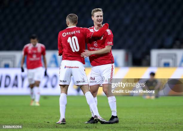 Filip Sachpekidis of Kalmar FF celebrates with Erik Israelsson of Kalmar FF at the full time whistle during the Allsvenskan match between AIK and...